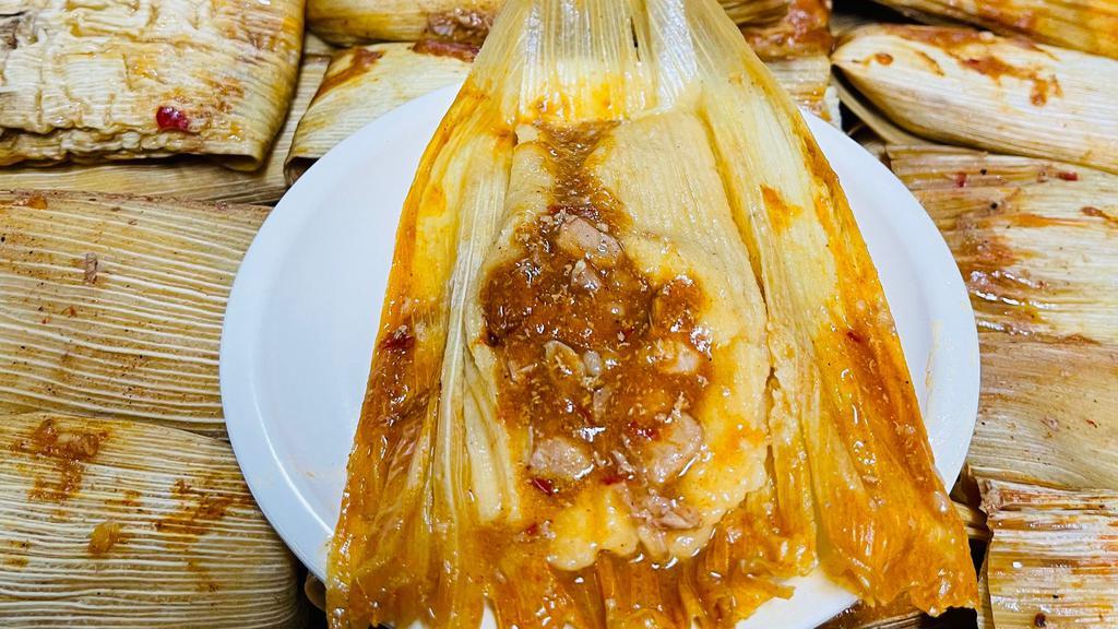 Homemade Tamales · Two tamales, made with fresh stone-ground corn masa, filled with Acapulco's special pork meat, wrapped in corn husks, served with beans and rice. Smothered for an additional charge.
