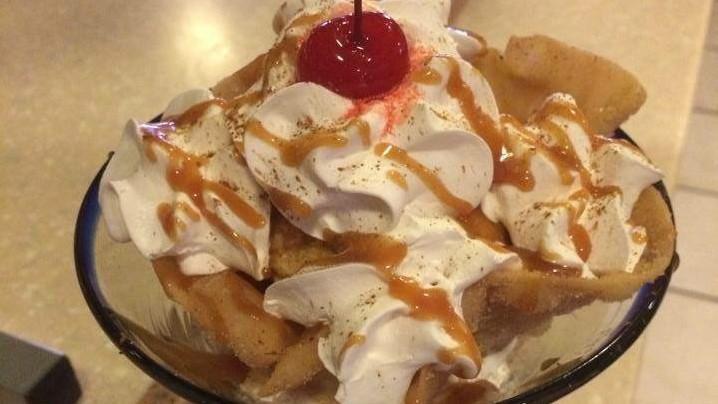 Fried Ice Cream · A scoop of French Vanilla ice cream rolled in a crispy coating, deep fried then served in a tortilla shell dusted with cinnamon and sugar, and topped with your choice of honey, chocolate, strawberry, or caramel and whipped cream.