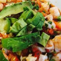 Shrimp Ceviche · Fresh shrimp cured in citrus juices and spiced with peppers. Served with cilantro, onions, t...