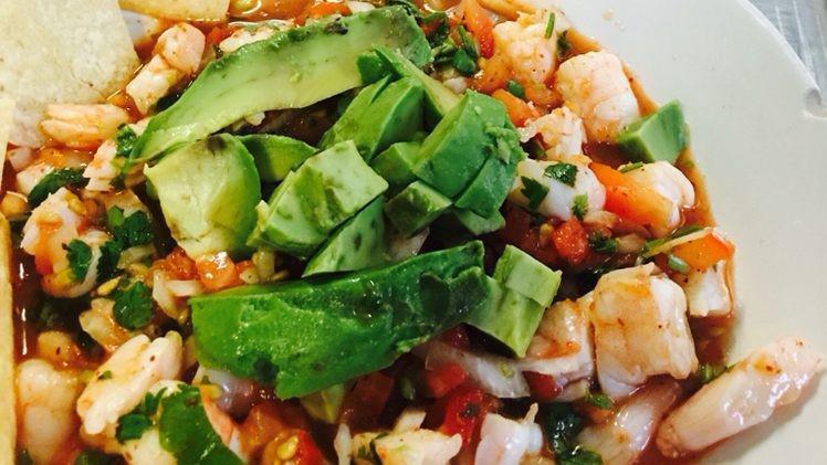 Shrimp Ceviche · Fresh shrimp cured in citrus juices and spiced with peppers. Served with cilantro, onions, tomatoes, cilantro and fresh avocados.