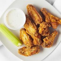 Breaded Chicken Wings · Mild wings served with ranch dressing.