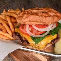 Gourmet Burger · Our delicious burger on a kaiser roll. Served with mayo, tomato, onions, and lettuce. 8 oz.