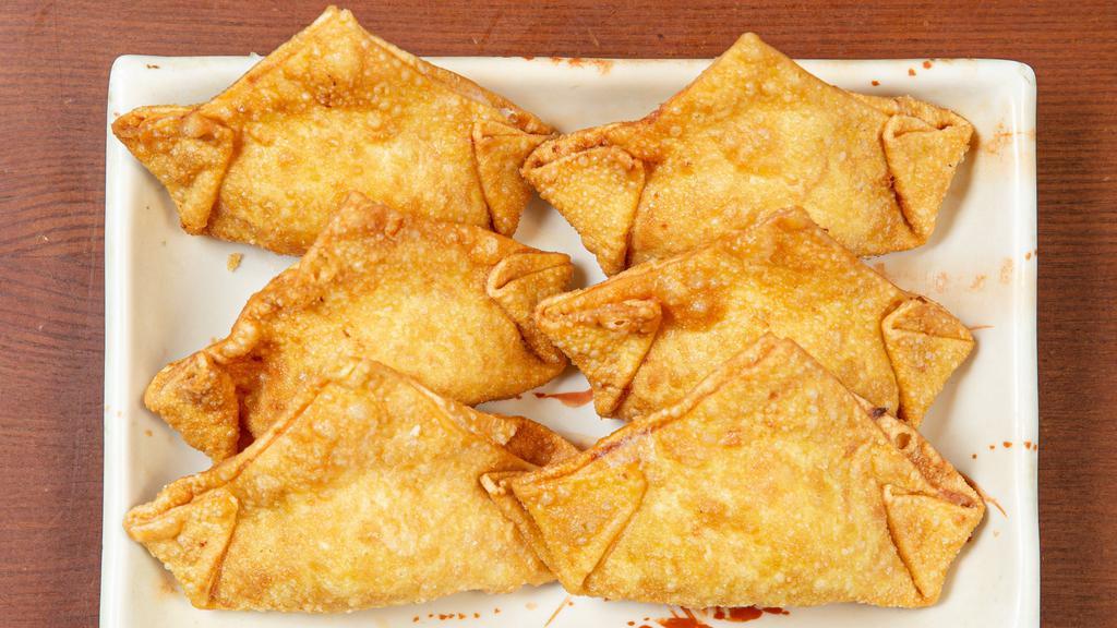 Crab Rangoon 6 Pcs) · Deep fried combination of cream cheese and crabmeat.