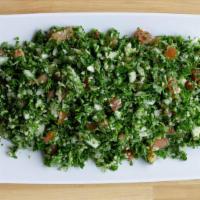 Tabouleh Salad · Finely chopped parsley, tomatoes and onions, mixed with mint, cracked wheat and dressed with...