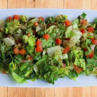 Arabic Salad · Chopped lettuce, tomatoes, cucumbers, onion, parsley and mint, dressed with fresh lemon and ...