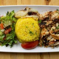 Chicken Shawarma · Thin slices of fire roasted chicken cooked on a revolving rotisserie, marinated with a varie...