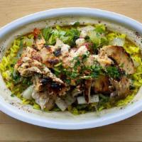 Chicken Shawarma Bowl · A layered Combination of Hummus, Rice, Chicken Shawarma and Arabic Salad.