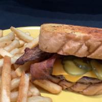 Texas Bacon Cheese Burger · Double Decker Burger, bacon, american cheese, pickle, ketchup, mustar on a garlic texas toast.
