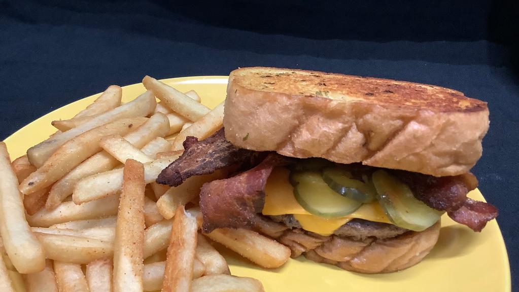 Texas Bacon Cheese Burger · Double Decker Burger, bacon, american cheese, pickle, ketchup, mustar on a garlic texas toast.