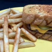 Texas  Cheesy Burger · Double Decker Burger, ketchup, pickle, american cheese on a garlic texas toast.