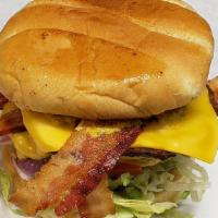 Big Bacon Cheese Burger · Double Decker Burger, American  cheese, grilled onions, double  Bacon, lettuce, tomato, pick...