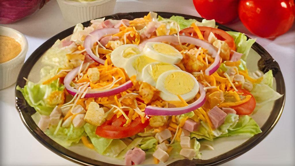 Chef Salad · Turkey, ham, Cheddar cheese, hard-boiled eggs, lettuce and tomatoes.