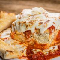Baked Lasagna · Homemade from the family recipe. Layers of pasta and three pieces of cheese smothered in mar...
