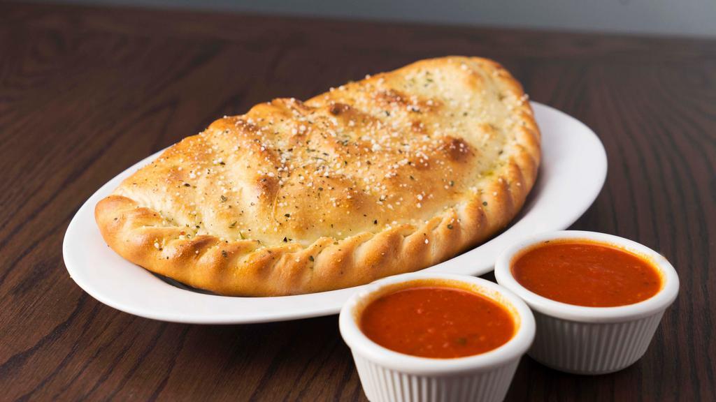 Calzone · Mozzarella cheese wrapped with butter-brushed dough, sprinkled with Parmesan, and oregano, then baked to perfection. Served with a side of marinara sauce. 1000 cal., with sauce: 1030 cal.