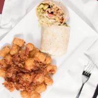 Southwest Wrap · Grilled chipotle steak or cajun rubbed chicken with diced tomatoes and corn-black bean salsa...
