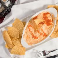 Buffalo Chicken Dip · (Signature item) handmade spicy buffalo chicken cheese dip, served with tortilla chips.