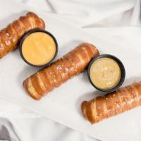 Pretzels & Cheese · (3) Long twisted soft pretzels, house made nacho cheese sauce.