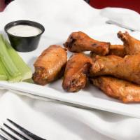 Signature Wings · Bone-in or boneless, 1 lb. choice of house made signature sauces served with celery & blue c...