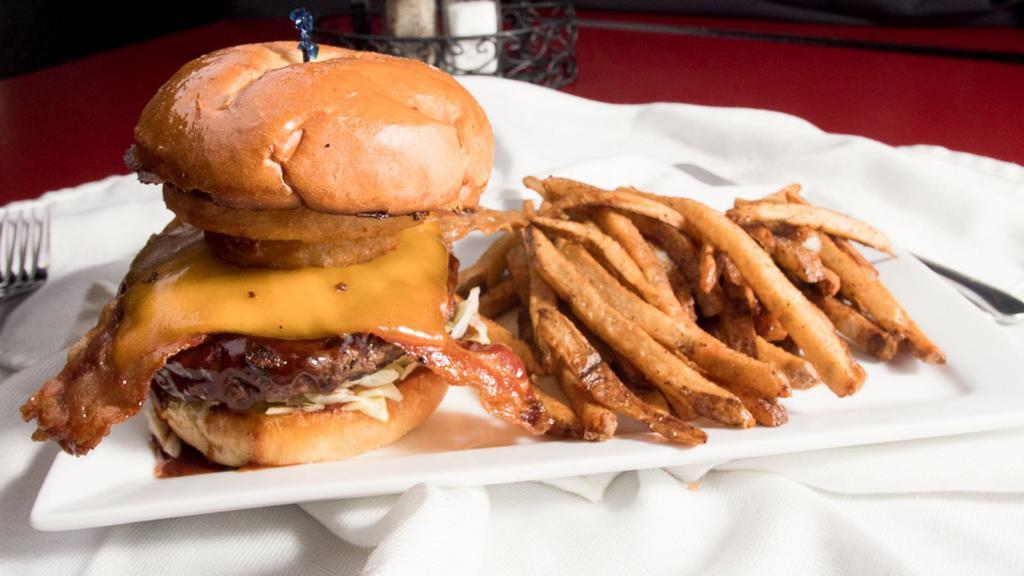 Smokehouse · Burger, BBQ sauce, bacon, sharp aged cheddar, crispy onion rings, lettuce, tomato.