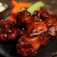 Traditional Classic Bbq · 8 BBQ wings (mild heat), served with carrots & celery and a choice of blue cheese, classic r...