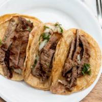 Steak · Lettuce, tomato, cheese, sour cream on corn tortilla.