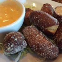 Beer Cheese & Pretzel Dippers · Made with seasonal beer, smoked Gouda, and cheddar cheese, with baked pretzel sticks.