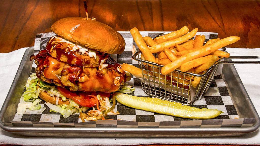 Cj’S Southern Burger · Topped with pulled pork, bacon, cheddar cheese, coleslaw, onion ring, and our smoky BBQ sauce on a brioche bun.