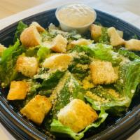 Caesar Salad · Romaine lettuce, garlic croutons, grated parmesan cheese, and our famous Caesar dressing
