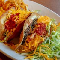 Traditional Taco Salad · Crispy flour tortilla filled with seasoned ground beef or shredded chicken. Topped with lett...