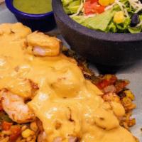 Shrimp Diablo · Grilled shrimp and vegetables covered in a fiery-rich cream sauce with Mexican rice and a si...