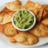 Guacamole Dip · Fresh homemade guacamole served with flour chips and jalapenos.