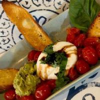 North End Burrata · Oven roasted tomatoes, garlic, olive oil, Italian spices, topped with burrata, house guacamo...