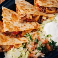 Lunch Quesadilla Hawaiana · Filled with beef, chicken, pineapple, chorizo, onions, peppers, tomatoes, served with lettuc...