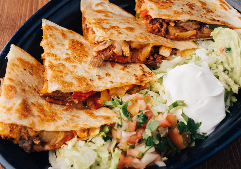 Lunch Quesadilla Hawaiana · Filled with beef, chicken, pineapple, chorizo, onions, peppers, tomatoes, served with lettuce, sour cream and pico de gallo