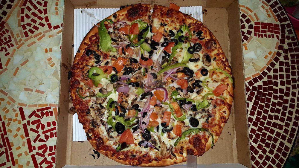 Veggie Round Pizza Medium · Mozzarella cheese, pizza sauce, green peppers, onions, black olives, mushrooms, and tomatoes.
