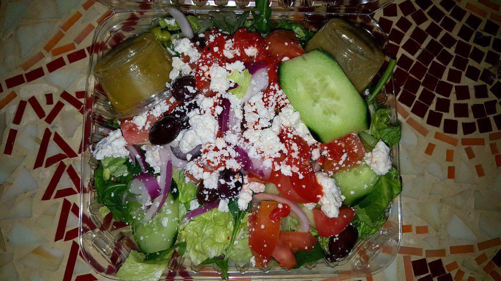 Greek Salad · Lettuce, tomato, feta cheese, onion, green pepper, black olives, pepperoncini, and beets.