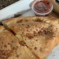 Pizza Turnover Calzone · Pizza sauce, mozzarella cheese, and pepperoni in a folded pizza dough pocket, oven baked and...