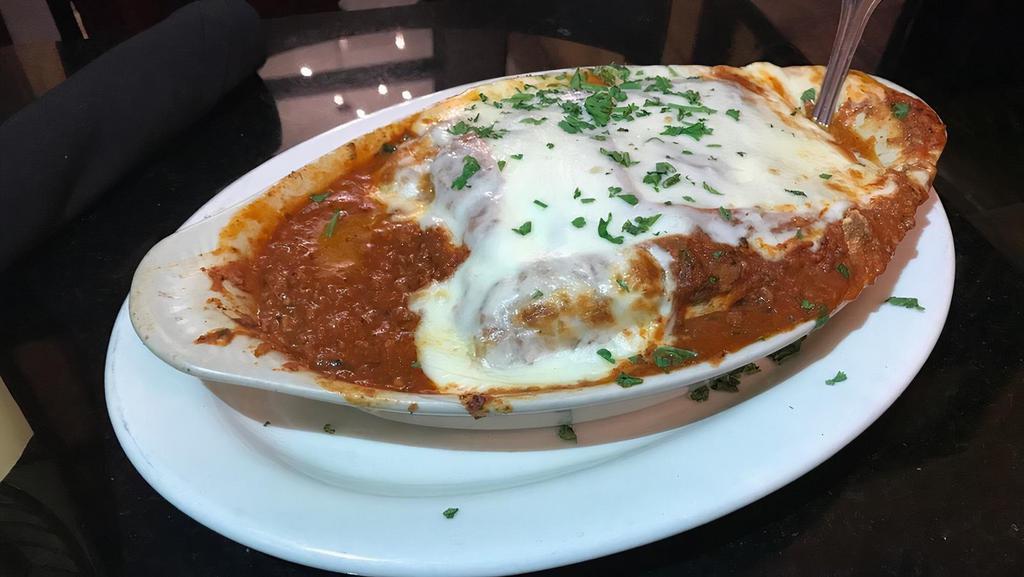 Lasagna · Include garlic bread and salad. Served meat  sauce.. Baked with cheese.