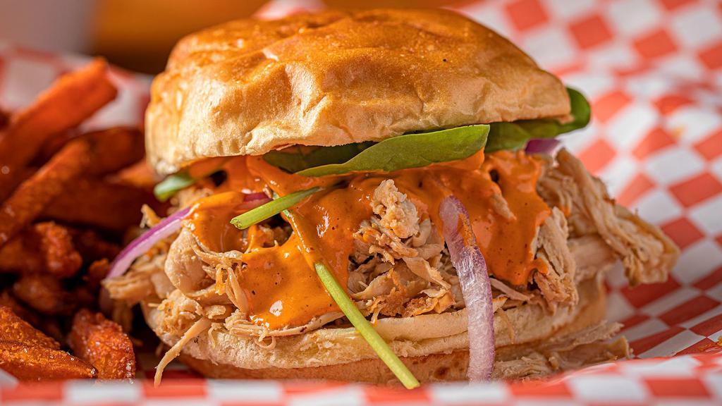 El Quemao Pulled Chicken Sandwich · As the pheonix rises from the ashes, so did this delicious pulled chicken sandwich. It brings just the right amount of heat with our homemade chipotle may sauce, red onion and spinach on a soft and lightly toasted brioche bun.