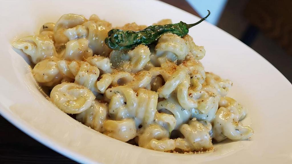 Pepper Jack Mac & Cheese · Our Signature Pepper jack Mac & Cheese and Trottole Noodles Topped with Bread Crumbs.