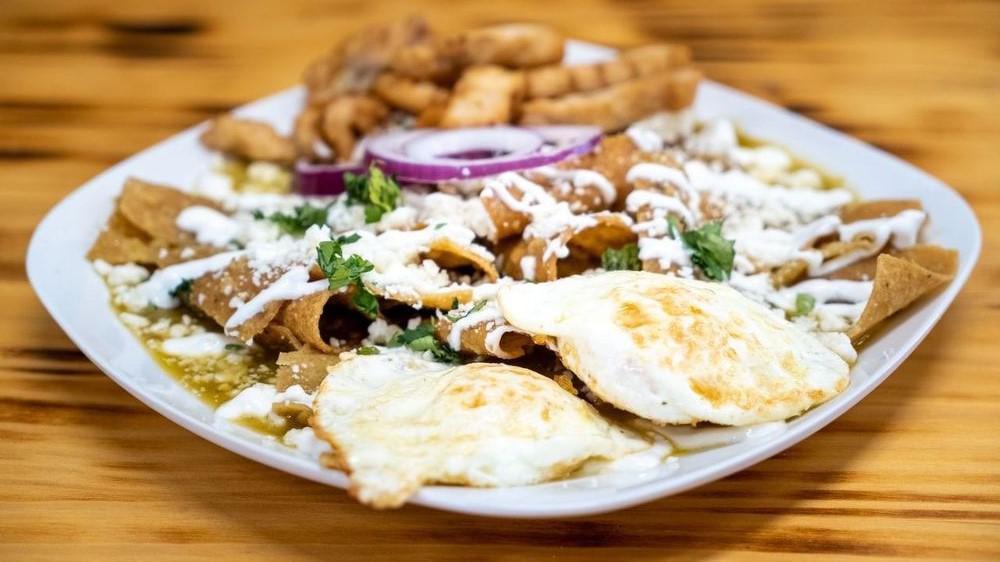 Chilaquiles Verdes · Strip tortilla  with Salsa Verde topped  with Cilantro,Onios & Sour cream. Served with 2 eggs your way!