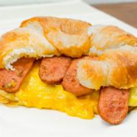 Croissant Breakfast Sandwich · Two eggs fried with cheese.