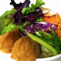 Vegan Salad · Sweet fried tofu stuffed with sushi rice served with asparagus, spring mix, romaine, purple ...