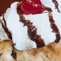 Fried Ice Cream · Breaded vanilla ice cream lightly deep fried. covered in chocolate whip cream and a cherry o...