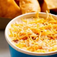 White Queso With Chorizo · Eight ounces of white creamy queso and melted cream cheese topped with mild chorizo and shre...