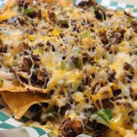 Nacho Grande · Tavern-fried tortilla chips topped with onion, green pepper, mixed cheese, and your choice o...