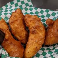 Chicken Fritters · Hand dipped, beer battered chicken tenders fried to a golden brown and served with dipping s...