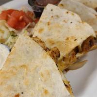 Chicken Quesadilla · Grilled chicken, mixed cheese, sautéed onions in a grilled tortilla. Served with lettuce, to...