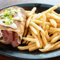 Corned Beef Boxty · Guinness braised corned beef and swiss cheese. Accented with our tavern-made horseradish sou...