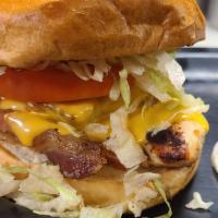 Grilled Chicken Club · Grilled chicken breast topped with hardwood smoked bacon, American cheese, lettuce and tomat...